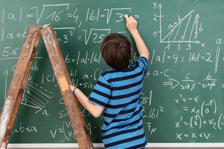 genius student at blackboard