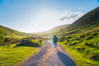 Man walking up a mountain road