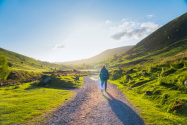 Man walking up a mountain road