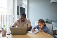 Parent using a laptop to access school information