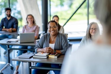 Teacher sitting at a desk