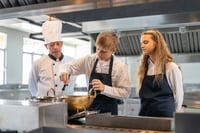 Male and Female student in a restaurant job experience