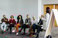 People listening to a speaker