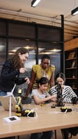 Female students learning robotics in the workplace