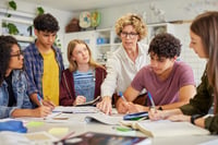 A teacher collaborating with  students