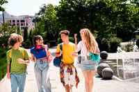 Teens talking outside on a sunny day