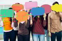 Multiple people holding speech bubbles