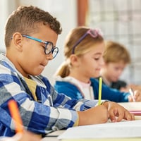 students writing in class